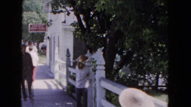 1961: a number of people walking down a sidewalk on a sunny calm day MICHIGAN