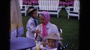 1961: A Happy Grandmother Enjoying Her Grandchildren on a Green Lawn in Minnesota
