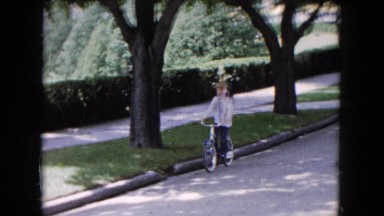 1961: A Little Girl Rides Her Bike in Minnesota