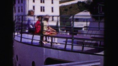 1961: people sitting on a deck along the railing of a large boat MINNESOTA