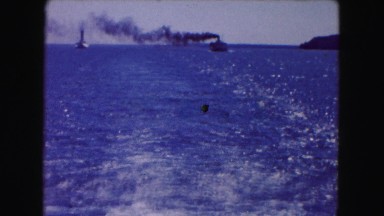 1961: water view mountain wide snow zoom waves moves boat MINNESOTA