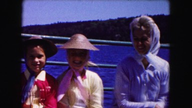 1961: women and children riding on boat MINNESOTA