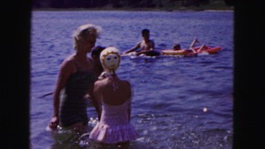 1961: women and girls splashing at a lake MINNESOTA