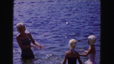 1961: a group of people bathing on a beach amusingly MINNESOTA