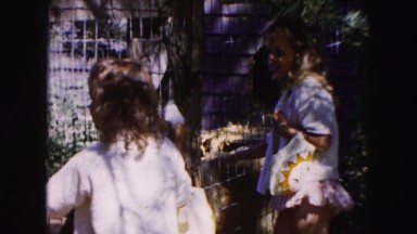 1961: two young girls standing outdoor in the shade of a tree MINNESOTA