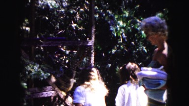 1961: Two Girls and an Adult Woman Watching a Monkey at a Minnesota Zoo