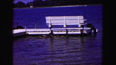 1961: ducks swim water platform for boat past MINNESOTA