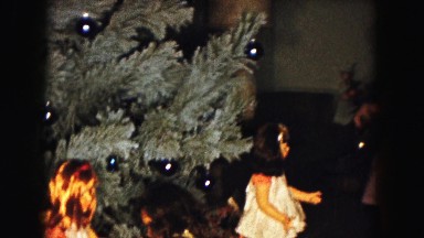 1961: Two Girls Dancing in Front of Christmas Tree in Minnesota Home