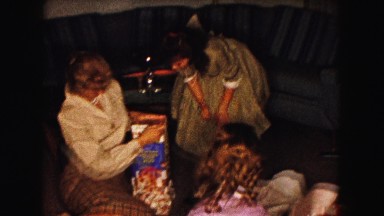 1961: various people on the livingroom floor opening christmas gifts MINNESOTA