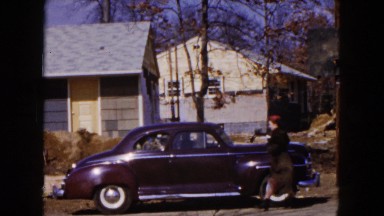 1954: cars passing by waving huge road parked cars HICKSVILLE, NEW YORK