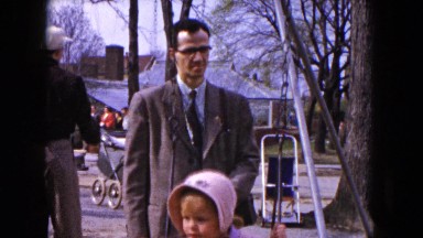 1954: A Father Helping His Daughter on the Swing HICKSVILLE, NEW YORK