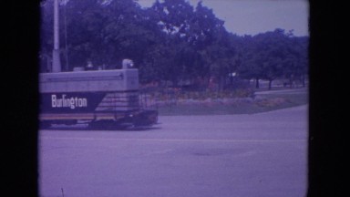 1972: a train arranged to ride circulating in the railway track in a wooded area
