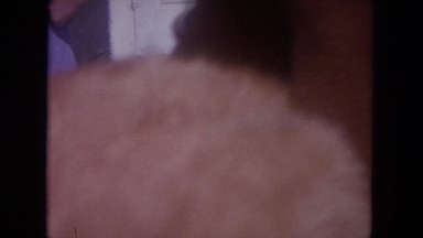 1972: older man holding a cat and passing it to a woman WISCONSIN