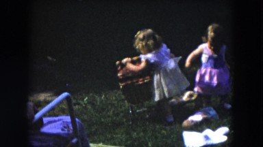 1954: kids playing pushing rope swinging dressed HICKSVILLE, NEW YORK