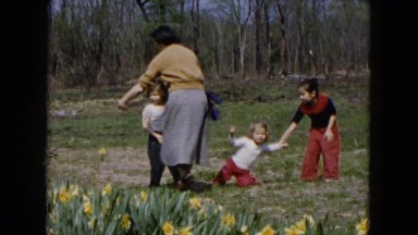 1955: kids are running around and playing in the field HICKSVILLE, NEW YORK