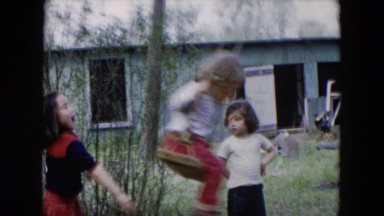 1955: three little girls play outdoor on a swing attached to a tree HICKSVILLE