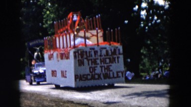 1955: A Large Pascack Valley Float Traveling Up the Street in a Town Parade