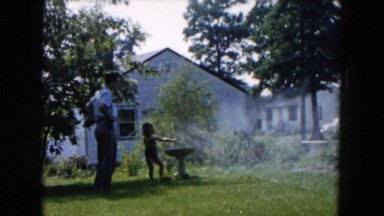 1955: garden water house child bathe HICKSVILLE, NEW YORK