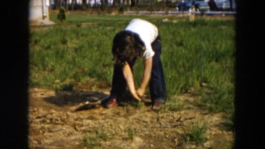 1955: a woman or a girl is working in the field HICKSVILLE, NEW YORK