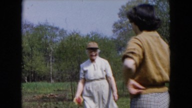1955: a young lady, old woman and a beautiful kid are playing ball HICKSVILLE