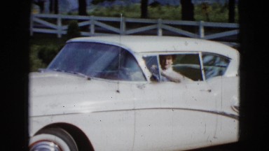 1958: woman driving home in her vehicle during the afternoon. NEVADA