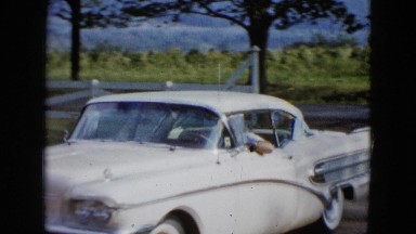 1958: a car arrives and man walks up NEVADA