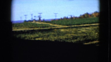 1958: a view of the countryside with rolling green hills and small pond NEVADA