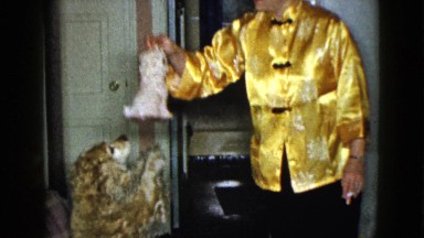 1958: woman playing with a toy and her cocker spaniel NEVADA