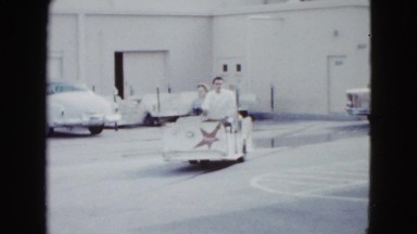 1958: a visitor having fun and going around the place in a white cart NEVADA