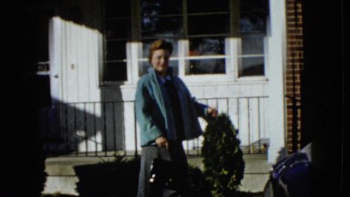 1958: woman leaving a house and getting into her car. NEVADA