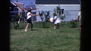 1955: brother and his two sisters playing in the backyard HICKSVILLE, NEW YORK