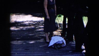 1955: women and a baby playing on the top of a bridge HICKSVILLE, NEW YORK