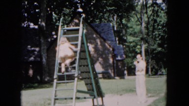 1955: little girl climbs ladder to go down playground slide HICKSVILLE, NEW YORK