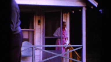 1964: an older woman leaving home and greeting another adult woman CALIFORNIA