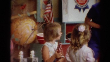 1964: a kindergarten class is participating in an activity with their teacher