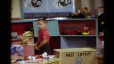 1964: school kids in classroom enjoy galloping on toy horses CALIFORNIA