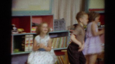 1964: three beautiful kids playing in the room by making circular motion