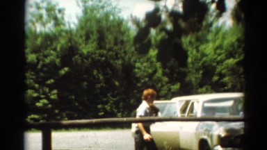 1964: family getting out of car with ball gloves CALIFORNIA