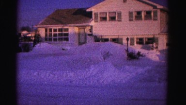 1967: snow covered road cleaning man shovel walk HAGERSTOWN, MARYLAND