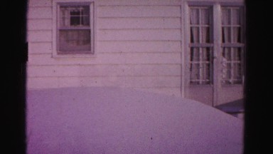 1967: a very tall snow drift or pile of sand against a white house HAGERSTOWN