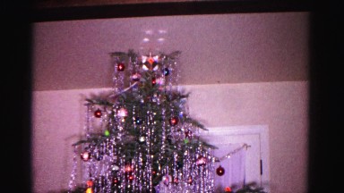 1967: colorful christmas tree inside a house