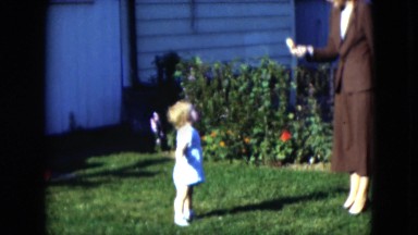 1951: the young toddler seeks out a delicious snack from his mother CLEVELAND