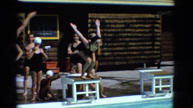 1953: kid swimming pool freestyle move fast water waves diving jump NEW YORK