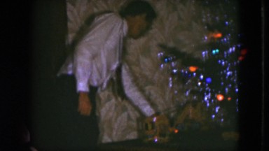 1951: a man is getting ready to celebrate the holidays with fun decorations.