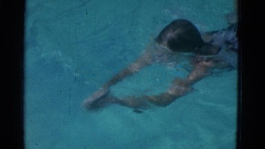 1953: a girl is swimming in the pool NEW YORK