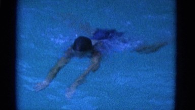 1953: teenage girl swimming breaststroke in pool NEW YORK