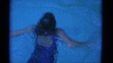 1953: young girl swimming in pool practicing breaststroke NEW YORK