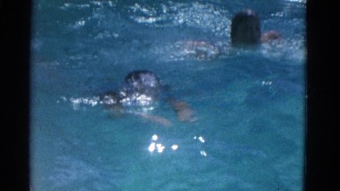 1953: two children practicing swimming techniques and having fun NEW YORK