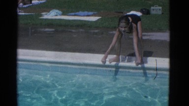 1953: a girl is having a competition in swimming in the pool NEW YORK
