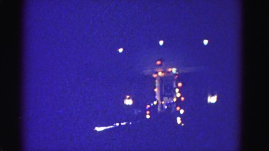1967: front entrance of a home seen from outdoor on a night during christmas